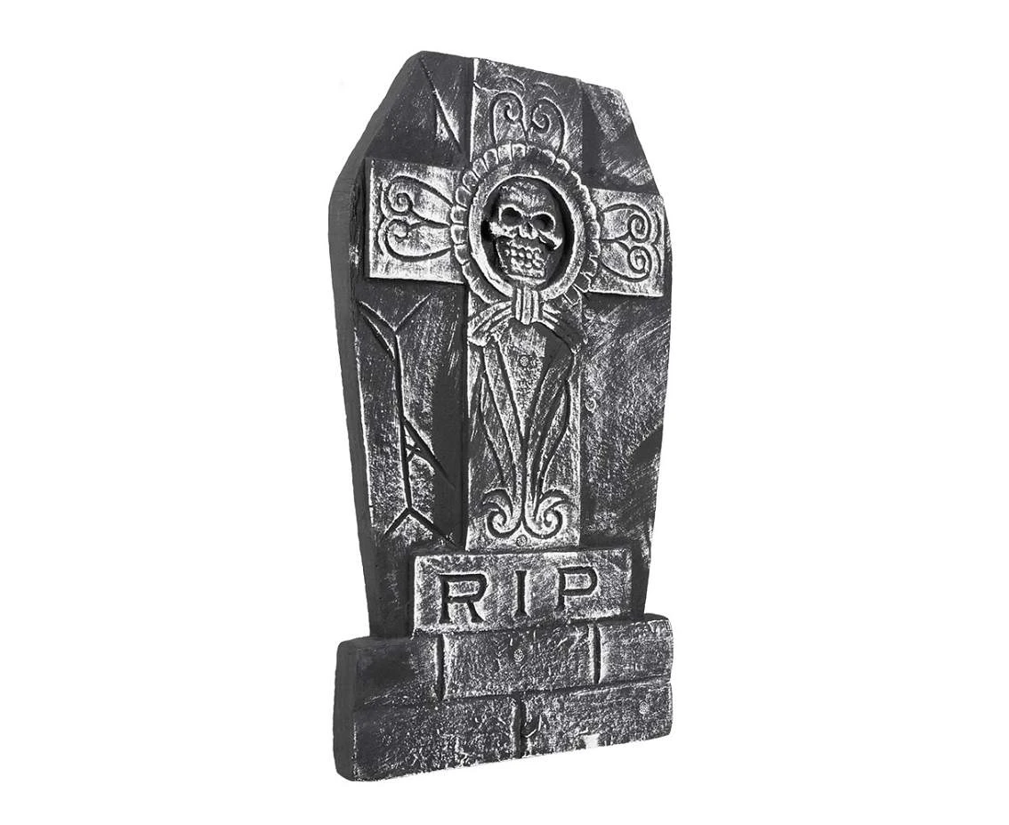 tombstone with a cross and a skull